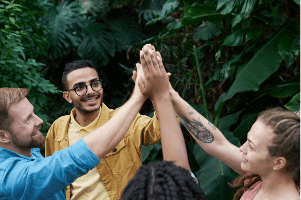 recovery support network of friends high-fiving