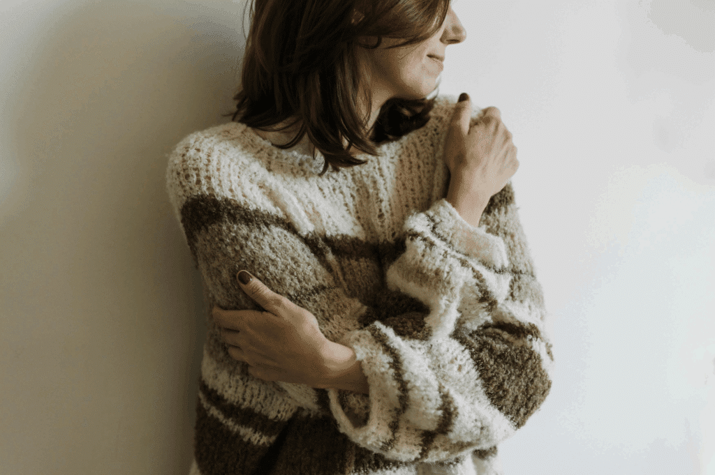 A woman thinking about Inexpensive Self Care Ideas for Addiction Recovery