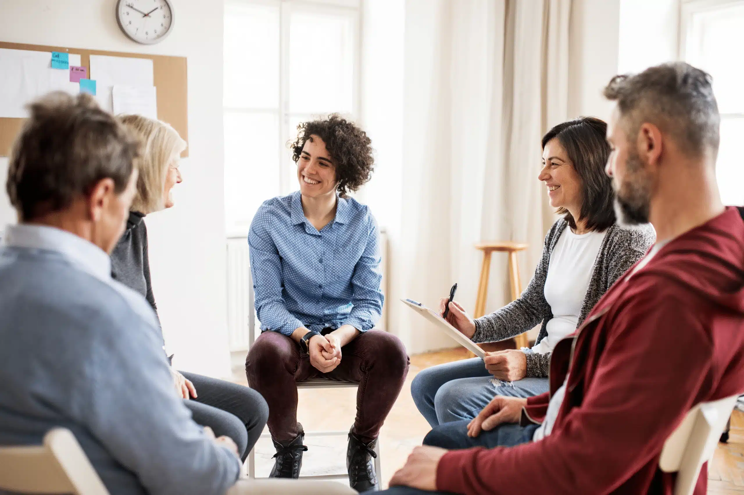 A group counseling session in progress as part of an intensive outpatient program (IOP).